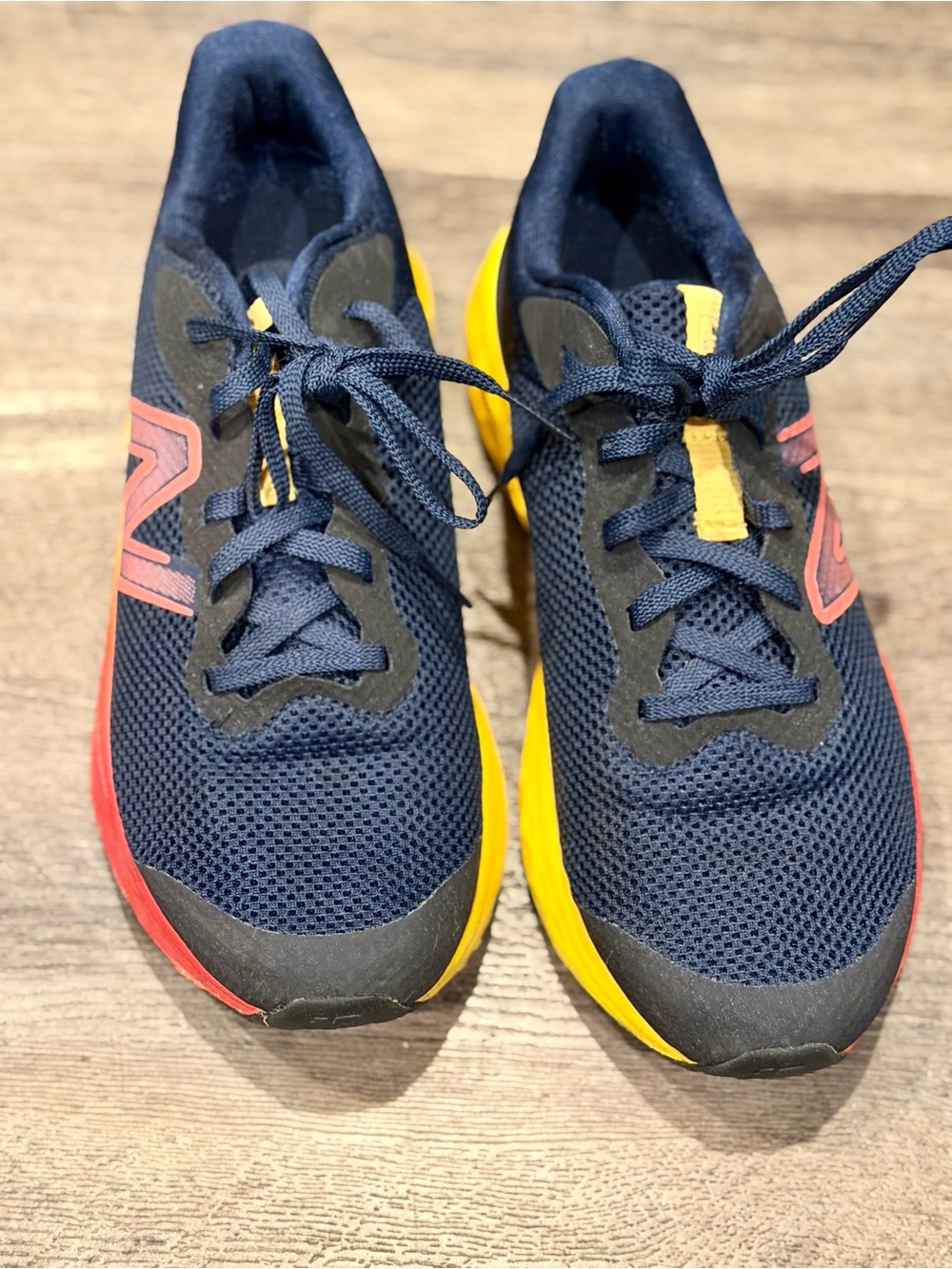 Kids Navy New Balance Shoes with Yellow & Red Accents